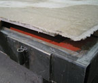 close-up photo of panel being removed from mold